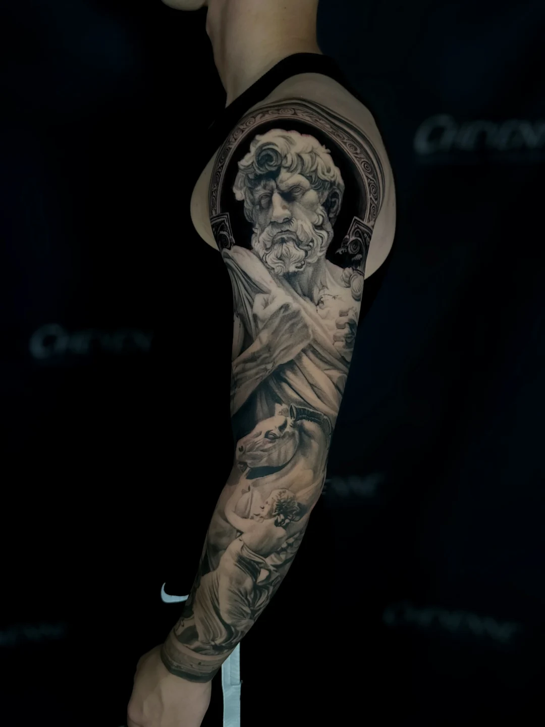 Black and grey realism statue tattoo