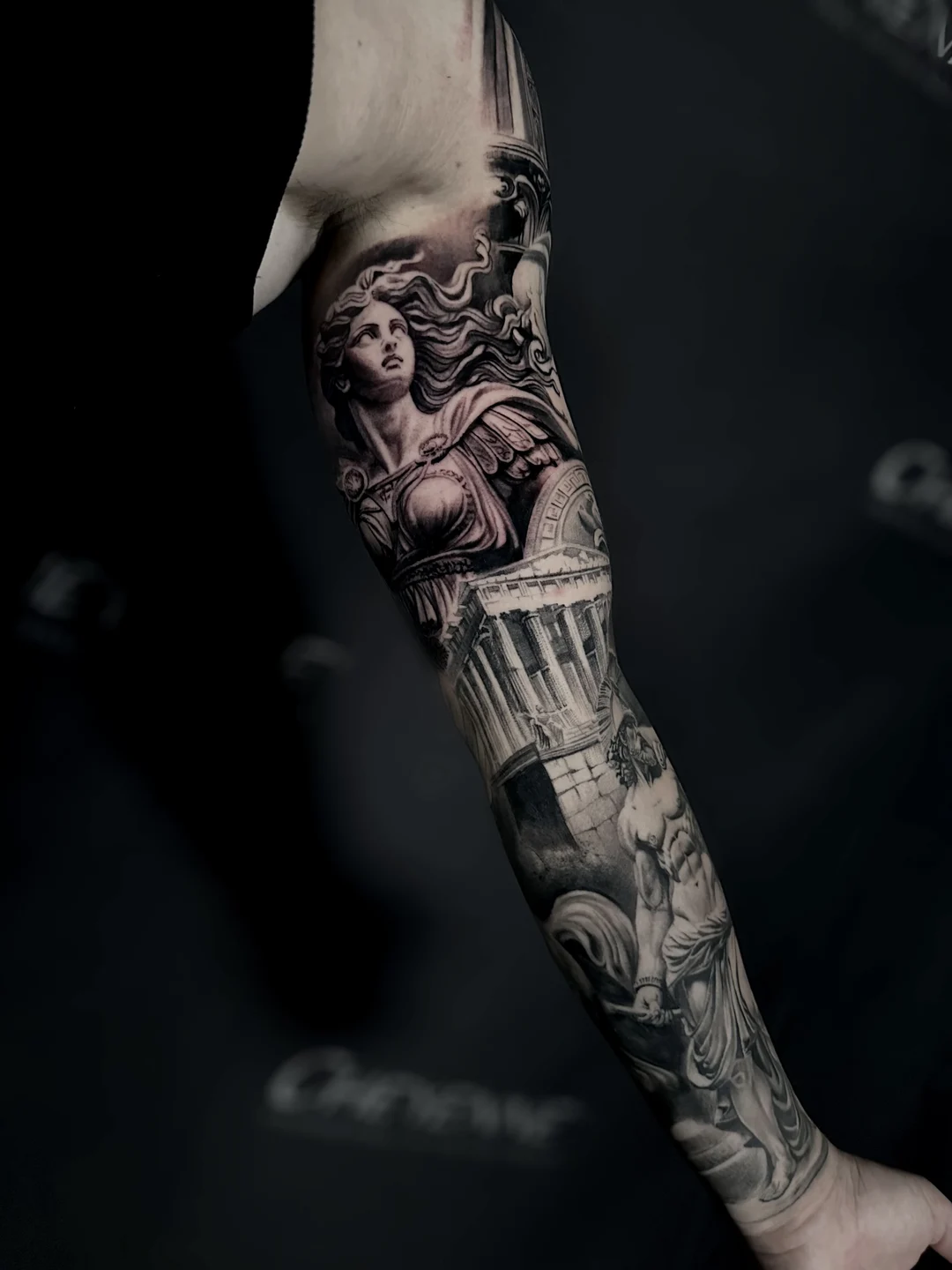 Realistic statue full sleeve tattoo, side view